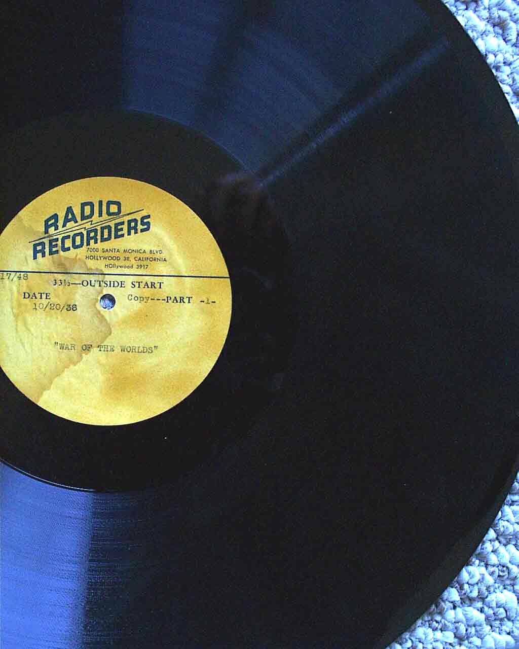 Black lacquer record with a yellow Radio Recorders label typed War of the Worlds