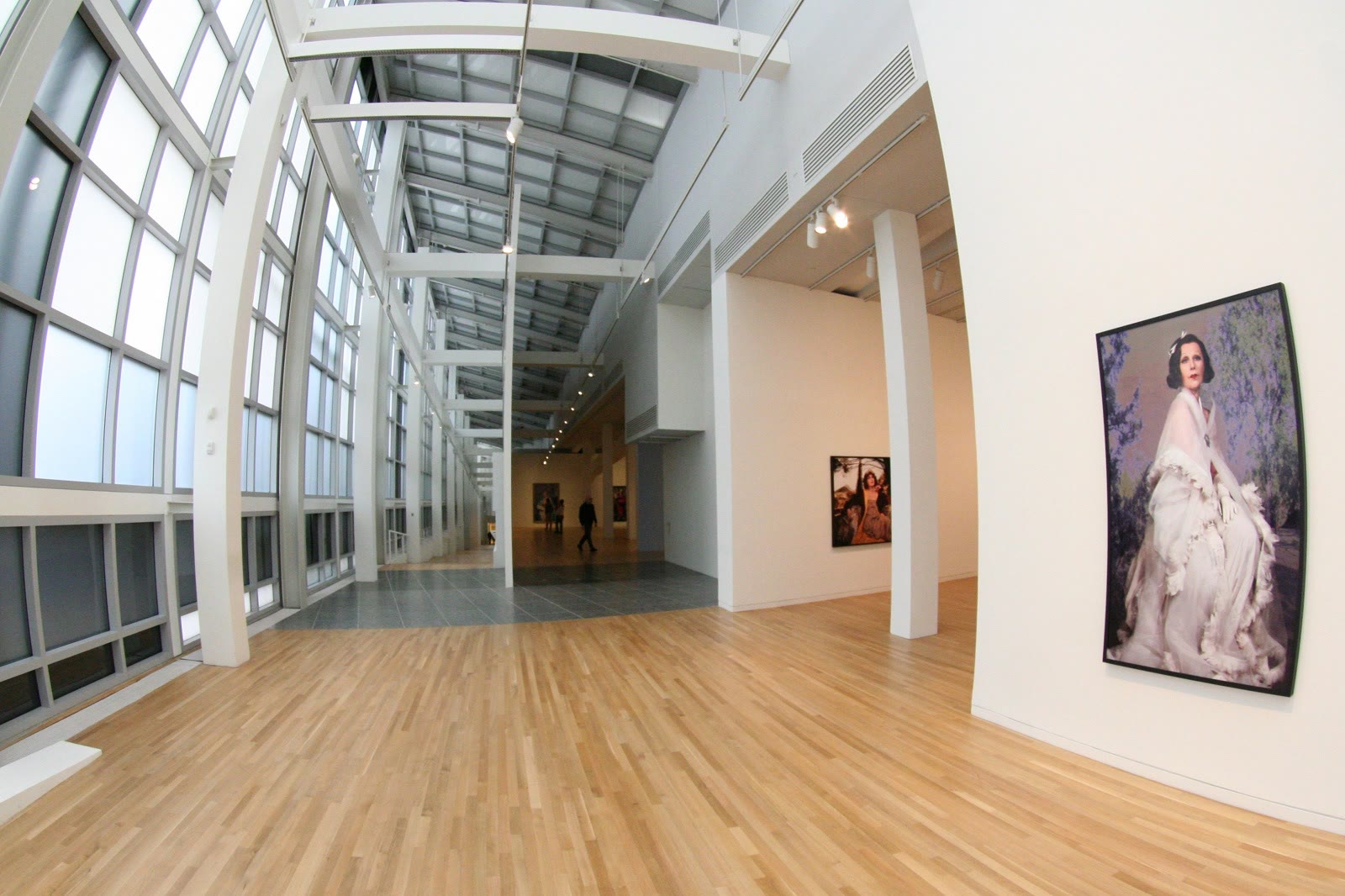 Hallway inside the Wexner Center for the Arts with a Cindy Sherman artwork on the right-hand wall