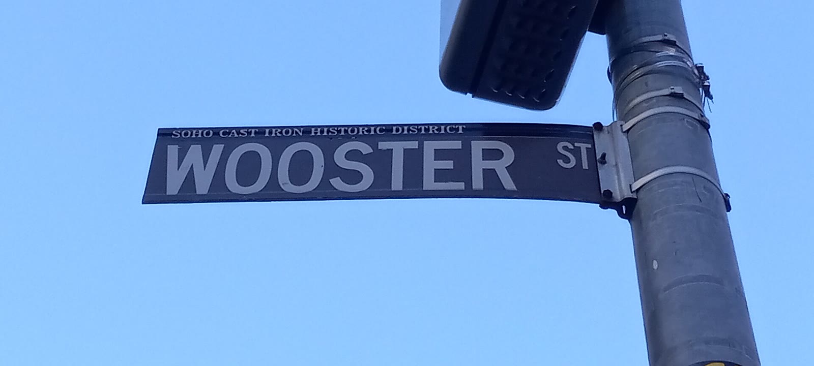 Street sign reading Wooster Street in SoHo, Manhattan