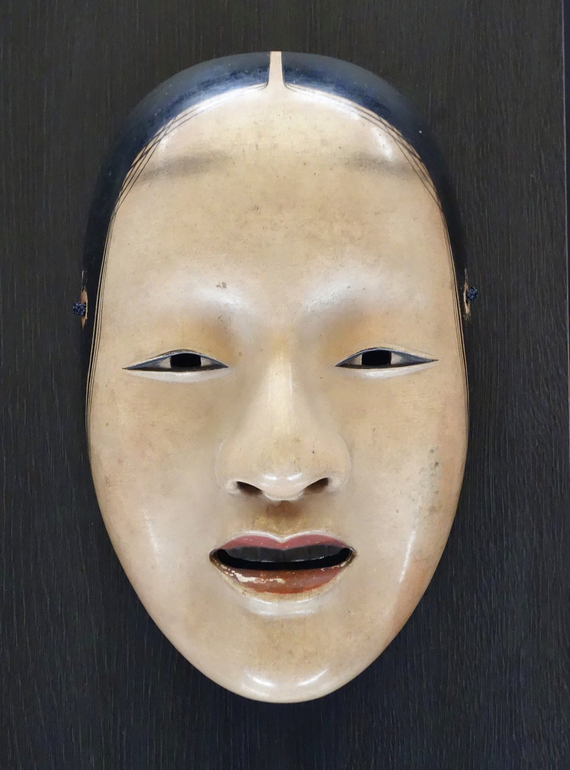A carved and painted wooden Zo-onna Noh mask of a woman's face, Edo period